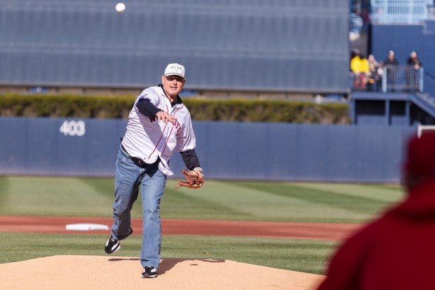 Roger Clemens throws the ceremonial first pitch to Rich Gedman, current Worcester Red Sox hitting instructor and his former batterymate, during Opening Day at Polar Park. (Libby O'Neill/Boston Herald)