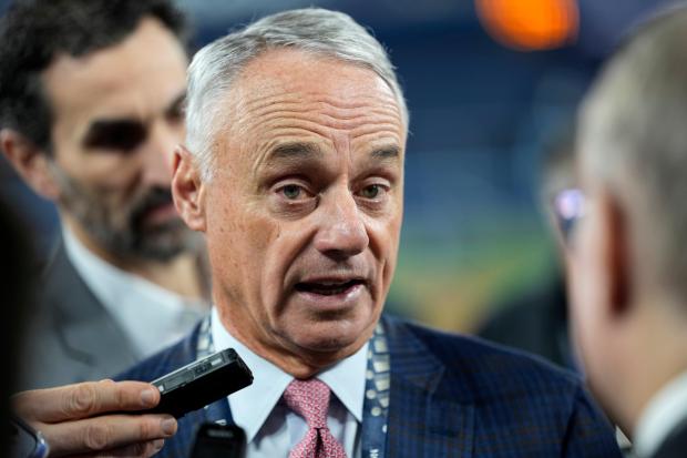 MLB commissioner Rob Manfred speaks prior to Game 2 of baseball's World Series between the Toronto Blue Jays and the Los Angeles Dodgers, Saturday, Oct. 25, 2025, in Toronto. (AP Photo/David J. Phillip)