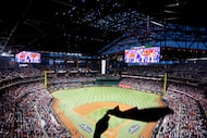 Fans cheer prior to Game 3 of an American League Divisional Series between the Texas Rangers...