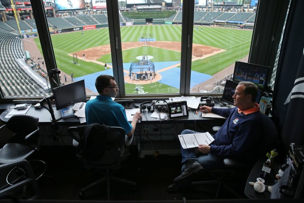 White Sox broadcasters Jason Benetti, left, and Steve Stone prepare for a game at Guaranteed Rate Field on July 14, 2017.