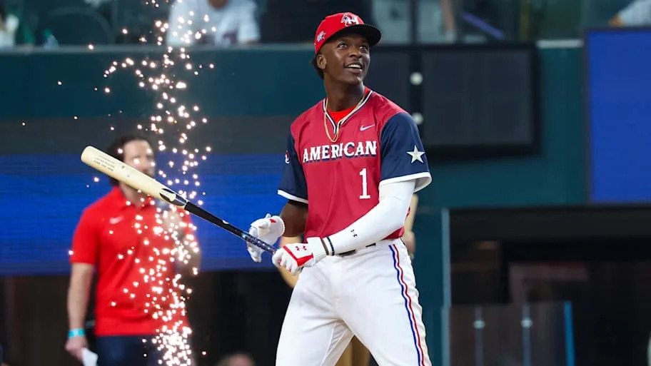 American League Future  infielder Sebastian Walcott walks to home plate with a bat in his hands.
