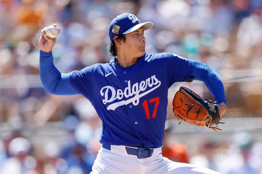 Shohei Ohtani of the Los Angeles Dodgers throws a pitch in the third inning during a Spring Training game against the San Francisco Giants.