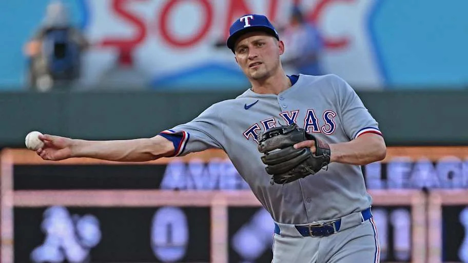 Corey Seager throws.