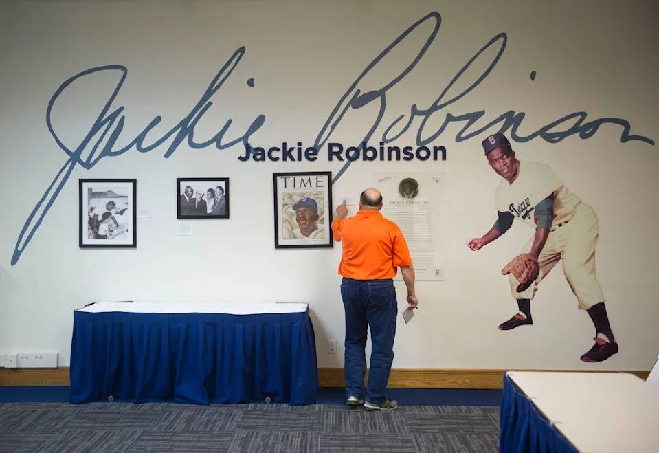 Laurence Reisman, community editor for TCPalm, studies a Jackie Robinson display Tuesday, Oct. 10, 2017, at Historic Dodgertown in Vero Beach.