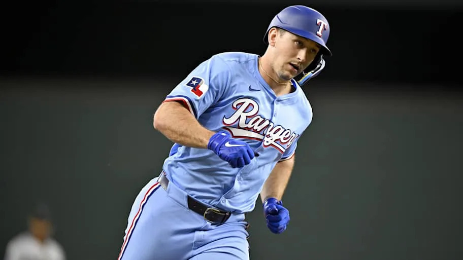 Texas Rangers left fielder Wyatt Langford rounds the bases after he hit a home run.