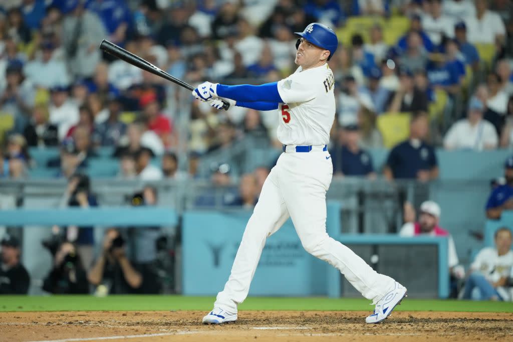 Los Angeles Dodgers infielder Freddie Freeman hits a deep fly ball to left field against the Arizona Diamondbacks during the seventh inning at Dodger Stadium. Mandatory Credit: Kirby Lee-Imagn Images Kirby Lee-Imagn Images
