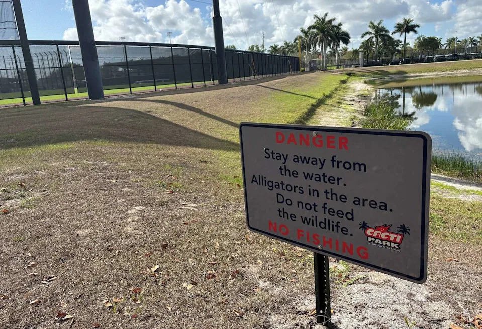 A sign warns fans of alligators in the pond outside the Houston Astros' spring training facility on Tuesday, March 8, 2026 in West Palm Beach, Florida. (Matt Young/Houston Chronicle)