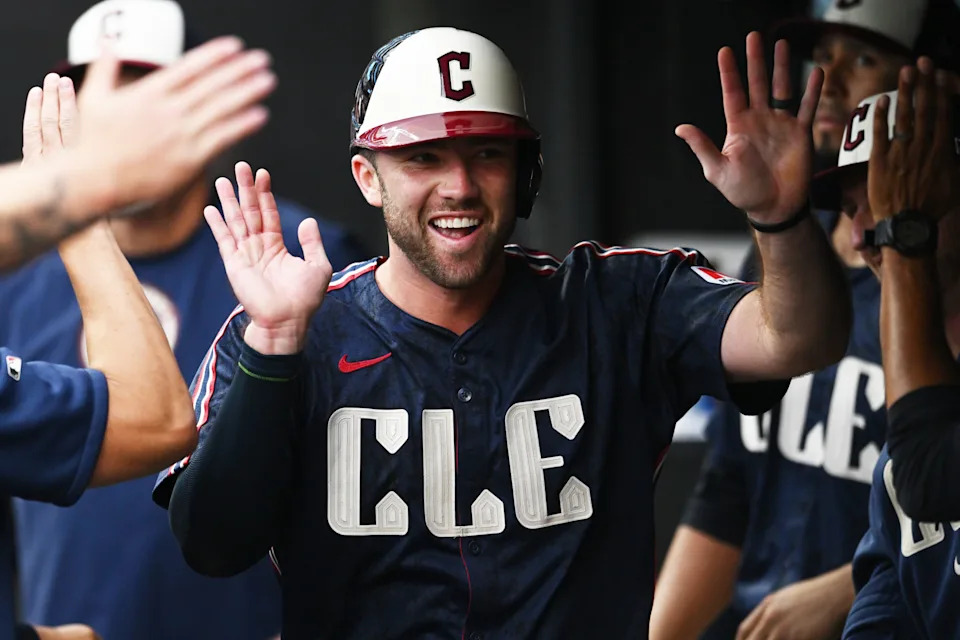 Cleveland Guardians' David Fry celebrates in the dugout with teammates after scoring against the Detroit Tigers on July 22, 2024, in Cleveland.