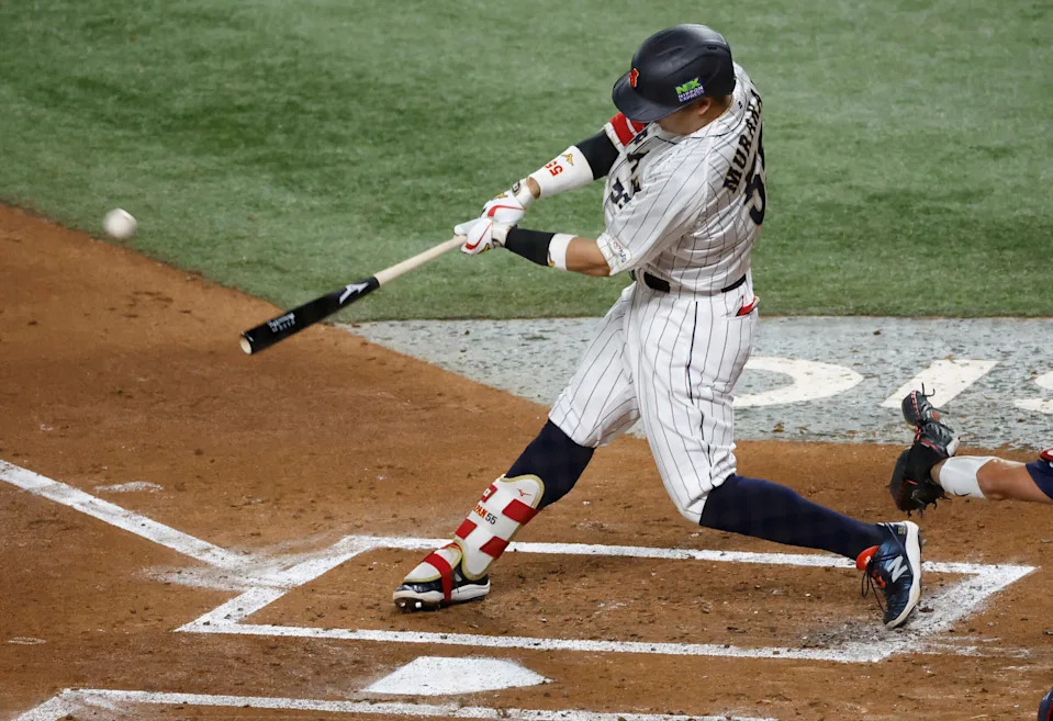 <p>Mar 21, 2023; Miami, Florida, USA; Japan third baseman Munetaka Murakami (55) hits a home run against the USA in the second inning at LoanDepot Park. Mandatory Credit: Rhona Wise-Imagn Images</p>