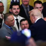 President Donald Trump speaks with Los Angeles Dodgers manager Dave Roberts during a ceremony honoring the members of the 2024 World Series Champion Los Angeles Dodgers in the East Room at the White House.