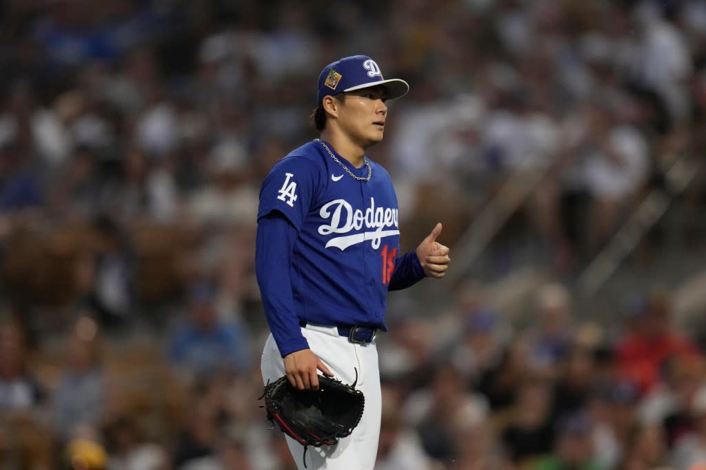 Los Angeles Dodgers starting pitcher Yoshinobu Yamamoto, of Japan, gives a thumbs up after striking out San Diego Padres’ Bryce Johnson during the third inning of a spring training baseball game, Friday, March 20, 2026, in Phoenix. AP