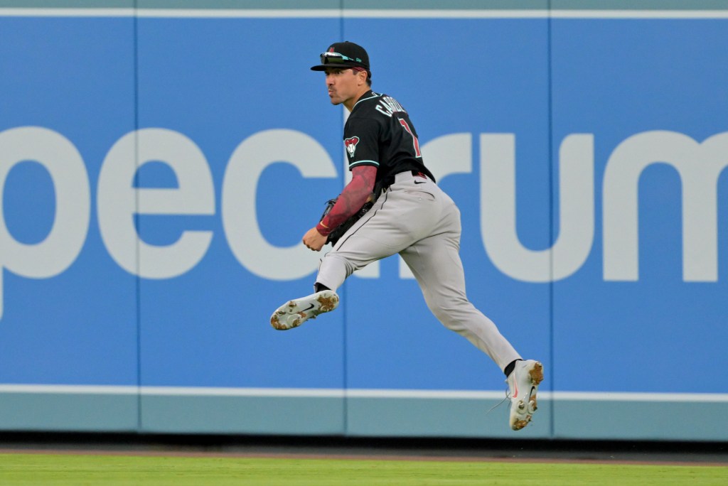 Arizona Diamondbacks right fielder Corbin Carroll throwing to the infield.