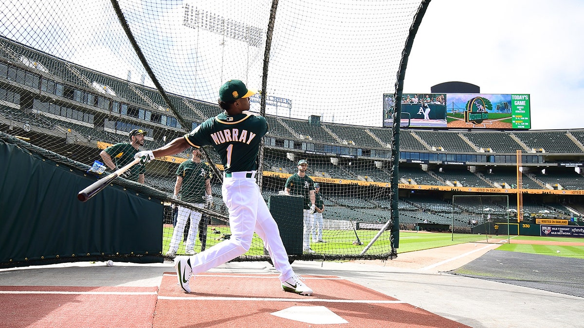 Kyler Murray batting during practice at Oakland Alameda Coliseum.