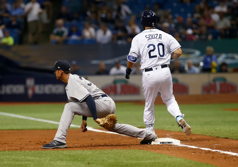 First baseman Greg Bird #33 of the New York Yankees makes the out on Steven Souza Jr. #20 of the Tampa Bay Rays.