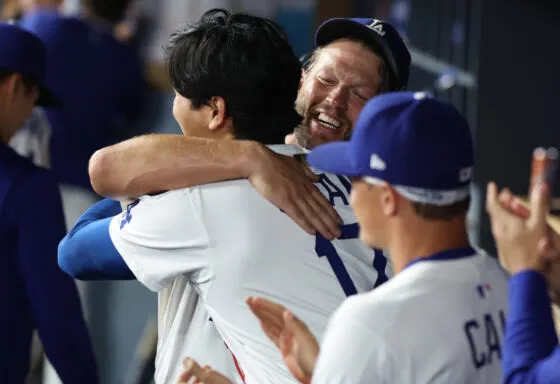 Sep 19, 2025; Los Angeles, California, USA; Los Angeles Dodgers pitcher Clayton Kershaw (22) is greeted by designated hitter Shohei Ohtani (17) after being relieved during the fifth inning against the San Francisco Giants at Dodger Stadium. Mandatory Credit: Kiyoshi Mio-Imagn Images