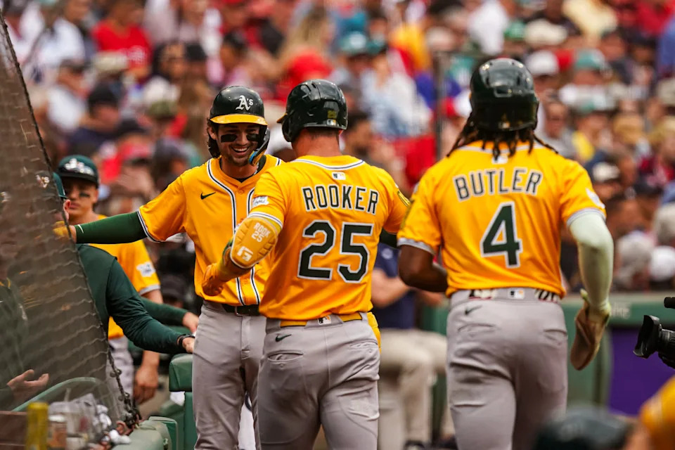 Sep 18, 2025; Boston, Massachusetts, USA; Athletics designated hitter Brent Rooker (25) is congratulated after hitting a two run home run against the Boston Red Sox in the first inning at Fenway Park. Mandatory Credit: David Butler II-Imagn Images