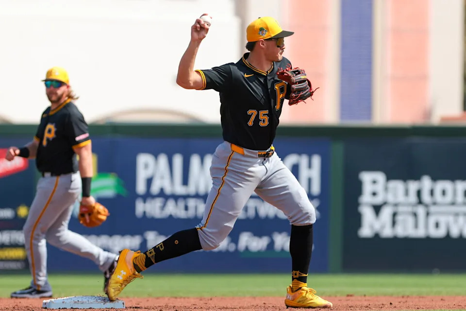 Mar 1, 2026; Jupiter, Florida, USA; Pittsburgh Pirates shortstop Konnor Griffin (75) turns a double play against the St. Louis Cardinals during the second inning at Roger Dean Chevrolet Stadium. Mandatory Credit: Sam Navarro-Imagn Images