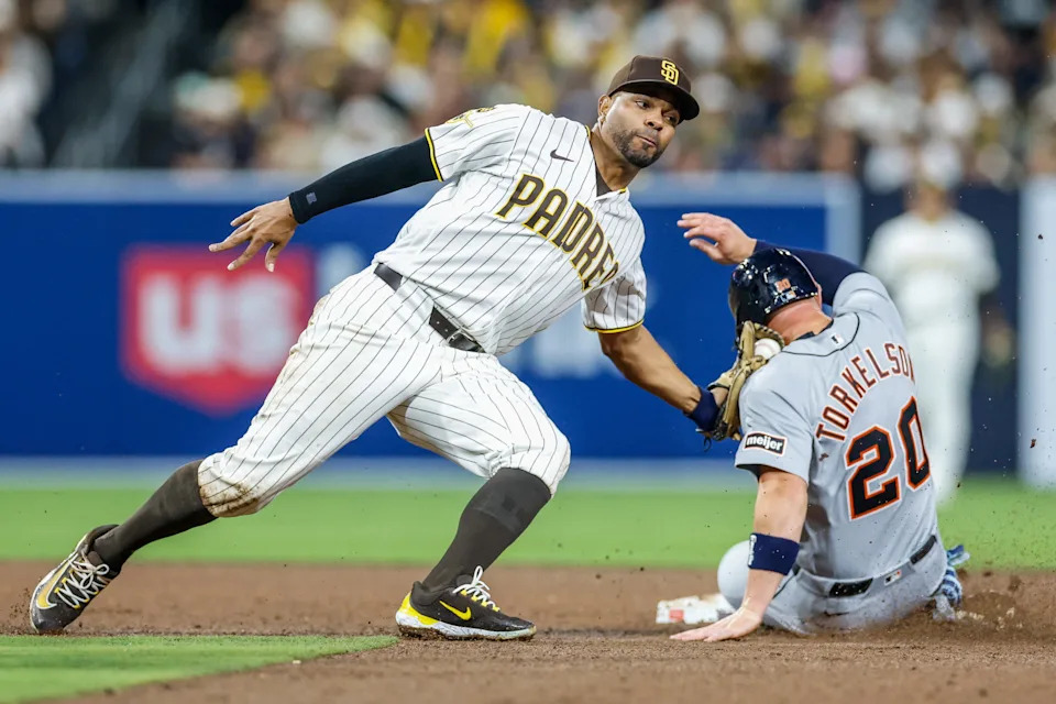 Mar 27, 2026; San Diego, California, USA; San Diego Padres shortstop Xander Bogaerts (2) tags out Detroit Tigers first baseman Spencer Torkelson (20) trying to steal second during the sixth inning at Petco Park. Mandatory Credit: David Frerker-Imagn Images