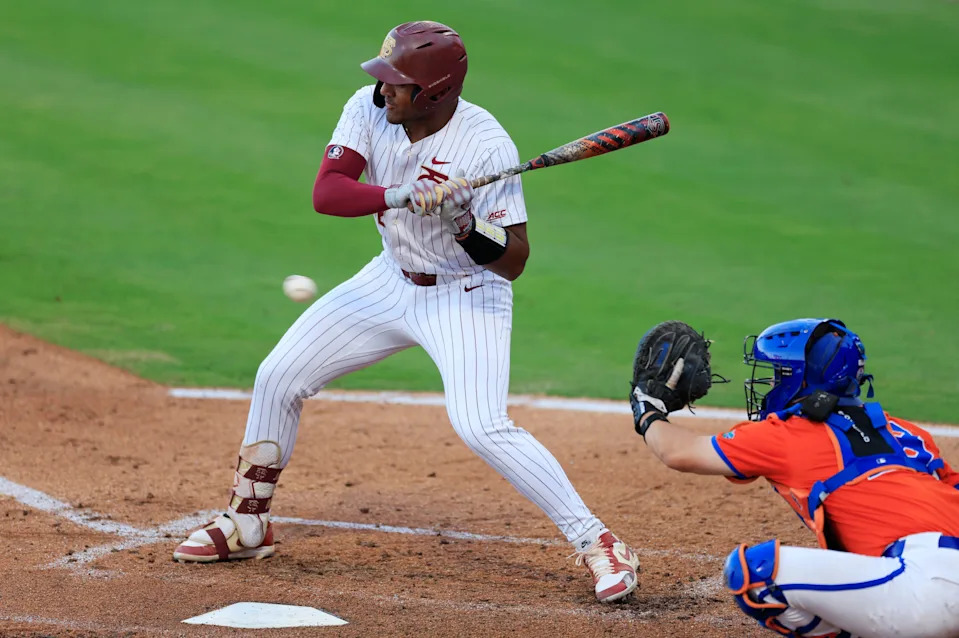 Florida St. infielder Myles Bailey (12) eyes a pitch during the fourth inning of an NCAA college baseball game against Florida in March 2025 in Jacksonville.