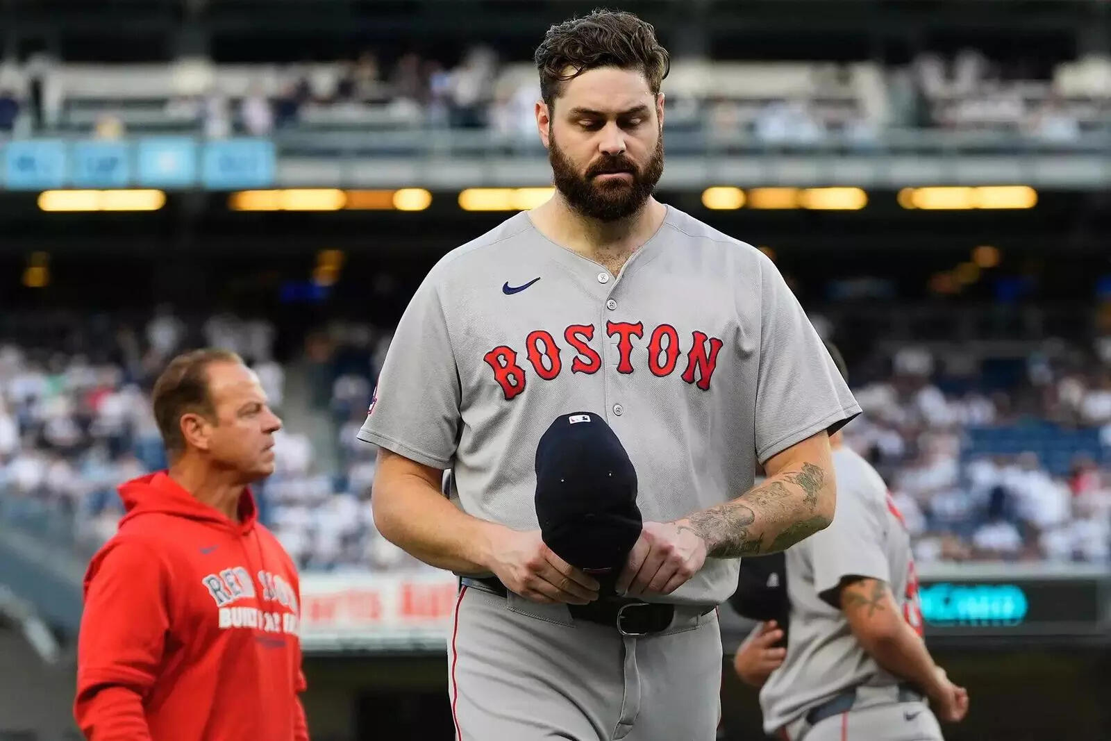 Boston Red Sox pitcher Lucas Giolito, left, walks off the field after player introductions before Game 1 of an American League wild-card baseball playoff series (Image via AP Photo) Boston Red Sox pitcher Lucas Giolito, left, walks off the field after player introductions before Game 1 of an American League wild-card baseball playoff series