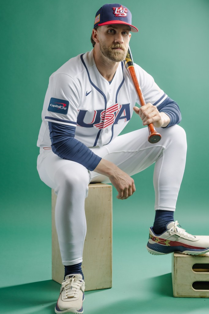 Bryce Harper in a Team USA baseball uniform holding a bat during a photo day.