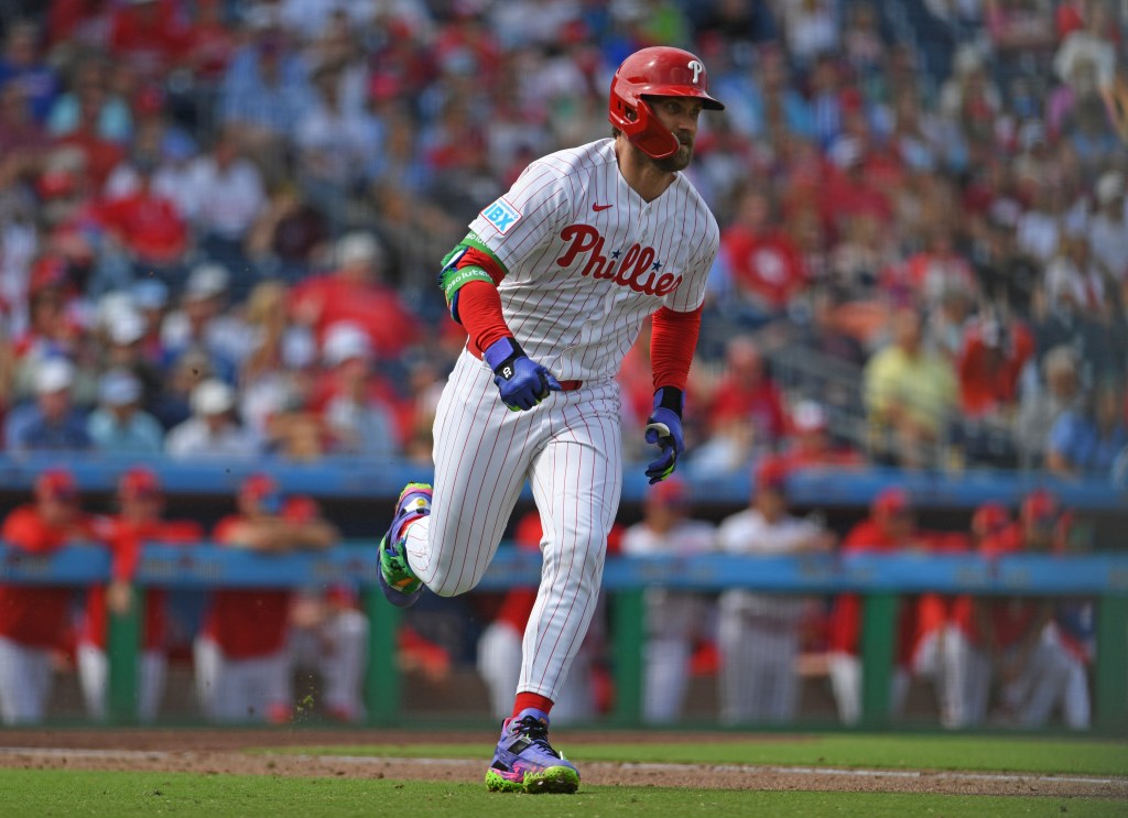 Bryce Harper running on the baseball field.