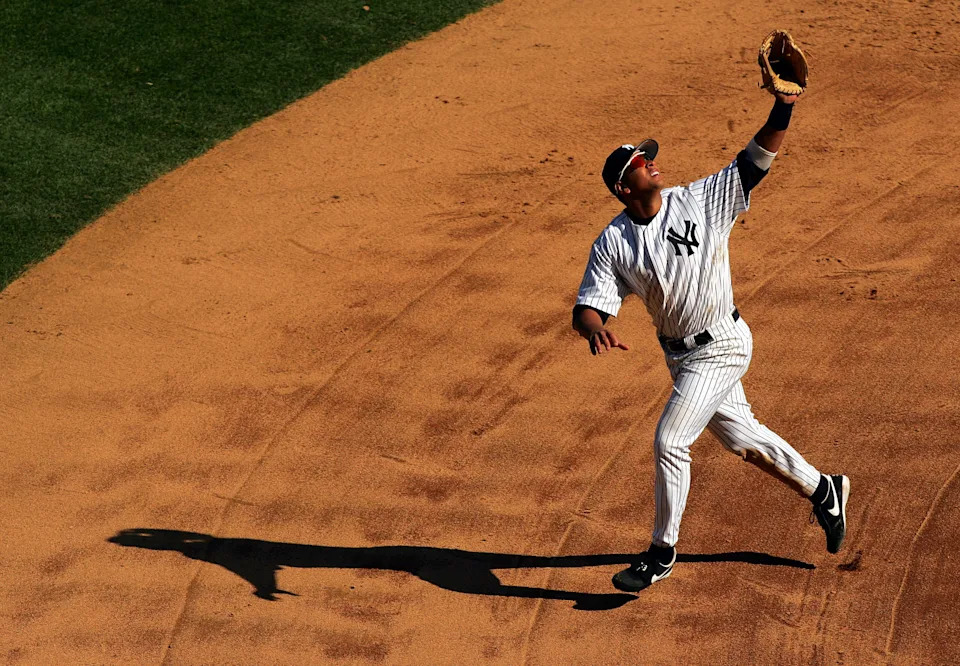Alex Rodriguez of the New York Yankees runs to catch a pop up against the Boston Red Sox.