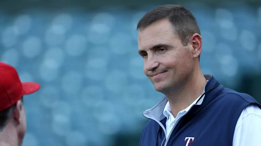 Texas Rangers General Manager Chris Young talks to a member of his staff.