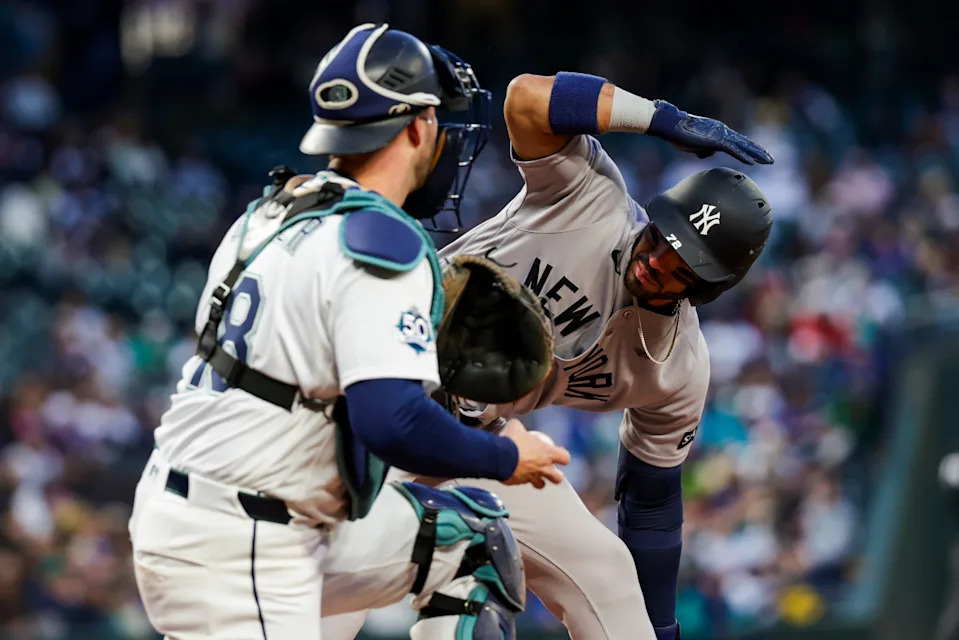 Mar 30, 2026; Seattle, Washington, USA; New York Yankees shortstop Jose Caballero (72) signals for an ABS challenge on a pitch by the Seattle Mariners during the third inning at T-Mobile Park. The strike was overturned and Caballero walked. Mandatory Credit: Joe Nicholson-Imagn Images