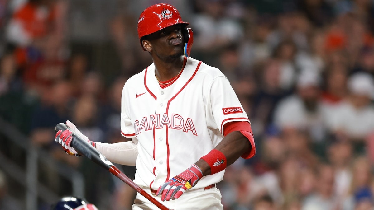 Denzel Clarke #1 of Team Canada reacts after striking out during the fifth inning against Team United States at Daikin Park on March 13, 2026, in Houston, Texas. 