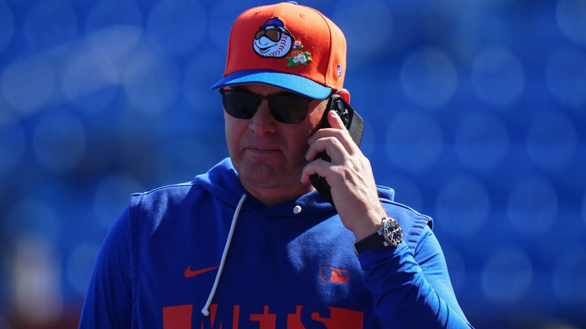 Carlos Mendoza #64 of the Mets uses the phone during spring training workouts. Rich Storry/Getty Images
