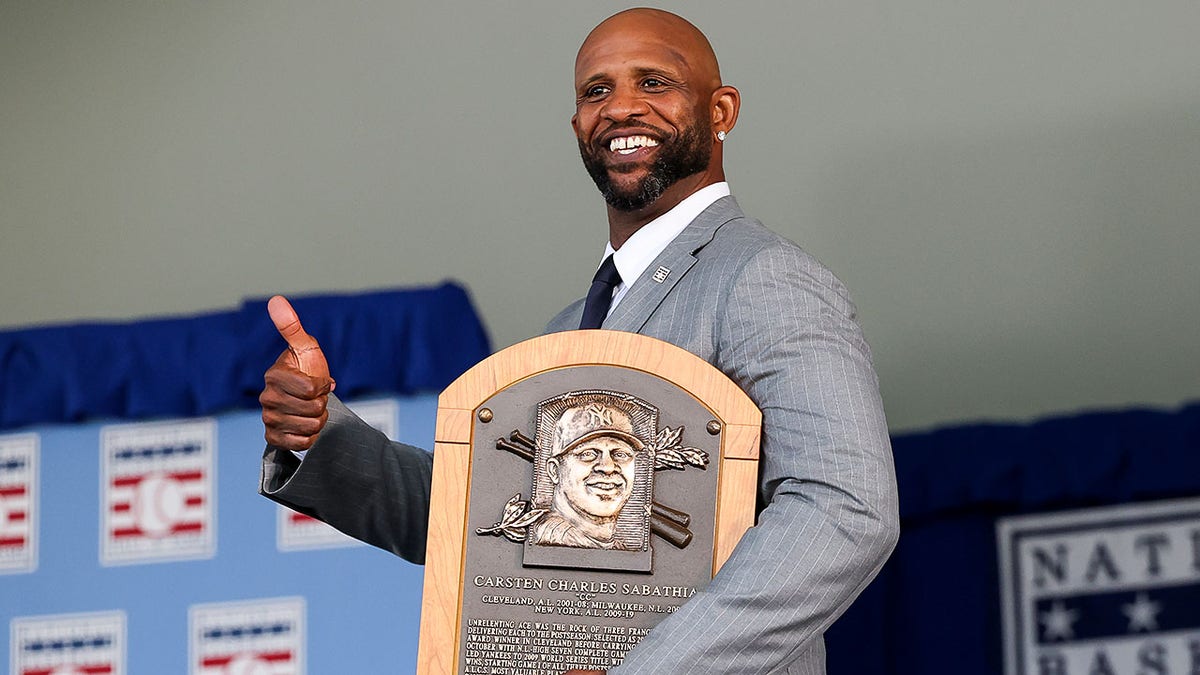 CC Sabathia thumbs up with Hall of Fame plaque
