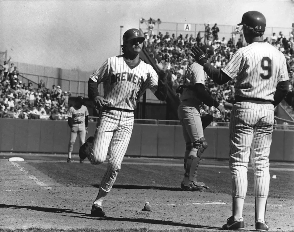 Robin Yount was welcomed at home plate by coach Greg Brock after scoring during a game on April 6, 1987. The Brewers started the year 13-0.