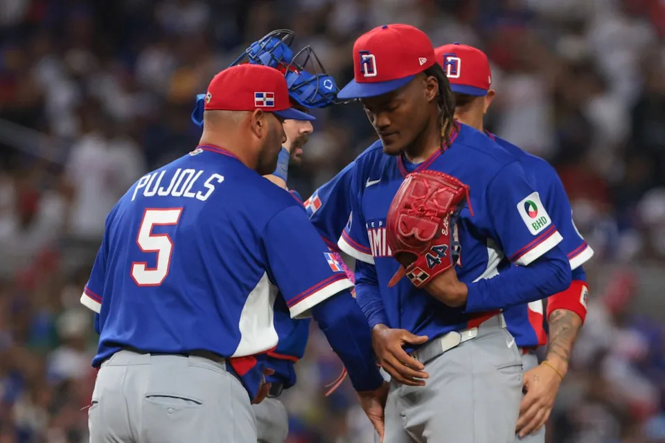 Dominican Republic pitcher Abner Uribe is taken out of the game by manager Albert Pujols during the ninth inning of their win against Venezuela at loanDepot Park. IMAGN IMAGES via Reuters Connect