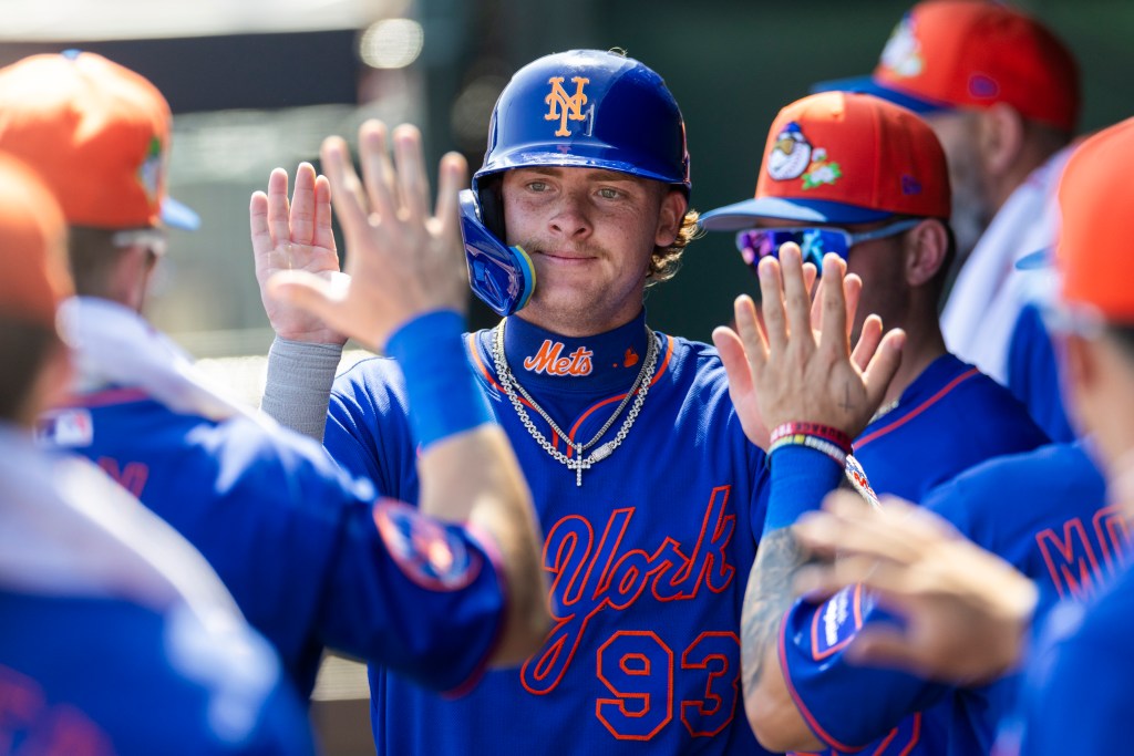 New York Mets’ Carson Benge (93) celebrates in the dugout after scoring on a wild pitch against the St. Louis Cardinals.