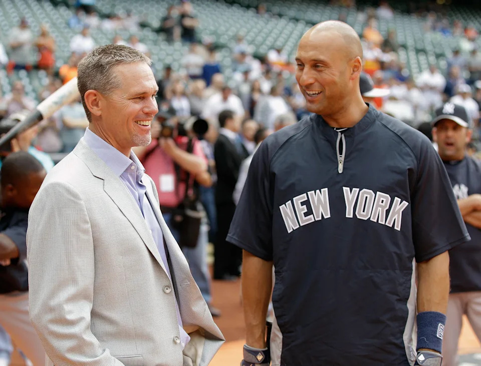 Derek Jeter of the New York Yankees, right, talks with former Houston Astros star Craig Biggio.