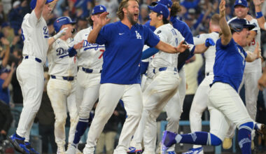 Oct 27, 2025; Los Angeles, California, USA; Los Angeles Dodgers pitcher Clayton Kershaw (22) celebrates with teammates after first baseman Freddie Freeman (5) hit a walk off home run against the Toronto Blue Jays in the eighteenth inning during game three of the 2025 MLB World Series at Dodger Stadium. Mandatory Credit: Jayne Kamin-Oncea-Imagn Images