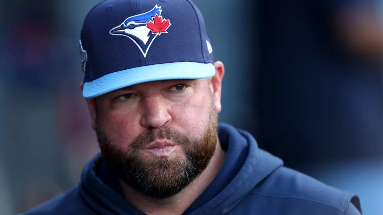 Toronto Blue Jays manager John Schneider reacts in the dugout amid discussion Cody Ponce’s injury.