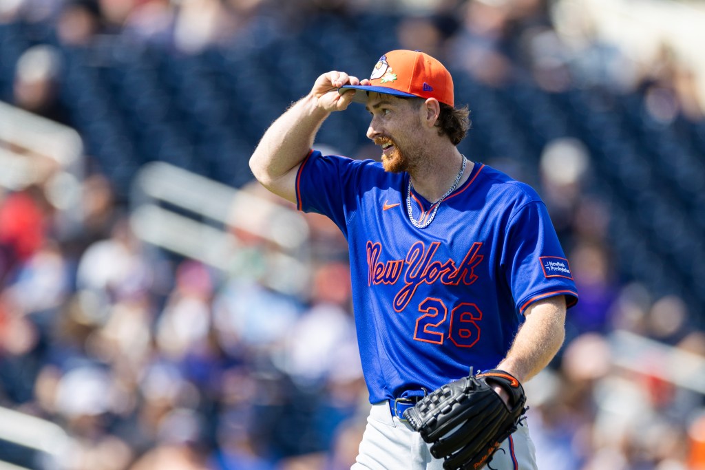 New York Mets pitcher Nolan McLean adjusts his hat after the fourth inning.