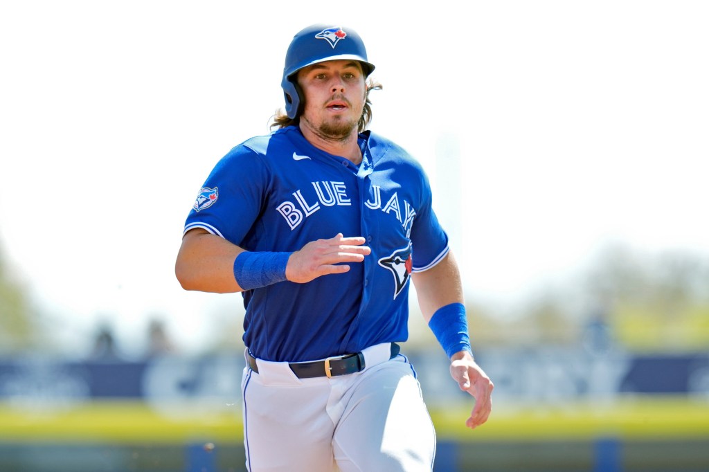 Toronto Blue Jays' Addison Barger runs to third base on a two-run single by Jesus Sanchez during the first inning of an exhibition baseball game against Canada Tuesday, March 3, 2026, in Dunedin, Fla.