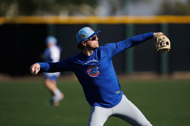 Nico Hoerner throws while warming up during Chicago Cubs spring training at Sloan Park on Thursday, Feb. 19, 2026, in Mesa, Ariz. (Armando L. Sanchez/Chicago Tribune)
