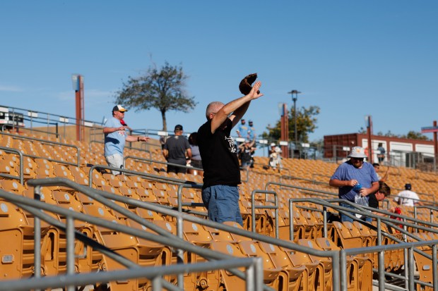 Fans wave towards the field after the Chicago White Sox defeated the Milwaukee Brewers, 5-2, in a Cactus League game at Camelback Ranch Sunday Feb. 22, 2026 in Glendale, Ariz. (Armando L. Sanchez/Chicago Tribune)