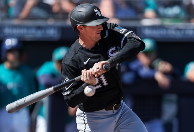 PEORIA, ARIZONA - FEBRUARY 24: Austin Hays #21 of the Chicago White Sox gets hit by a pitch during the first inning of the spring training game against the Seattle Mariners at Peoria Stadium on February 24, 2026 in Peoria, Arizona. (Photo by Mike Christy/Getty Images)
