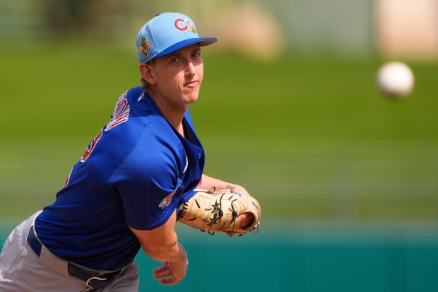 Chicago Cubs starting pitcher Ben Brown throws during the first inning of a spring training baseball game against the Kansas City Royals, Monday, Feb. 23, 2026, in Surprise, Ariz. (AP Photo/Charlie Riedel)