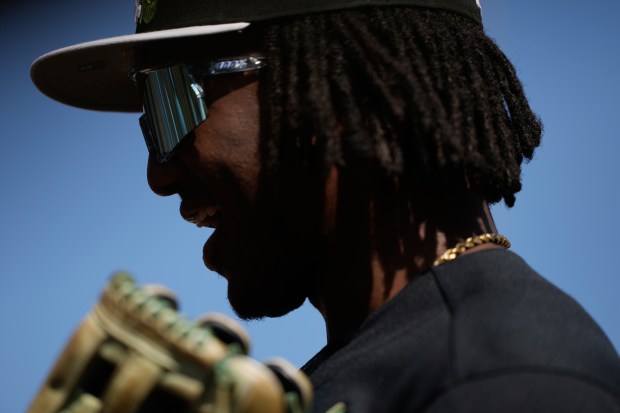 Chicago White Sox second baseman Luisangel Acuña walks off the field in the first inning during a spring training game against the Cincinnati Reds, Wednesday, Feb. 25, 2026, in Phoenix. (AP Photo/Brynn Anderson)
