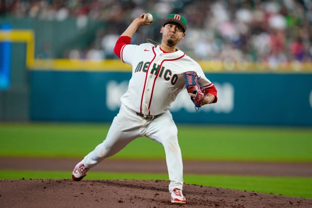 Mexico pitcher Javier Assad throws against Italy in the second inning of a World Baseball Classic game, Wednesday, March 11, 2026, in Houston. (AP Photo/Ashley Landis)