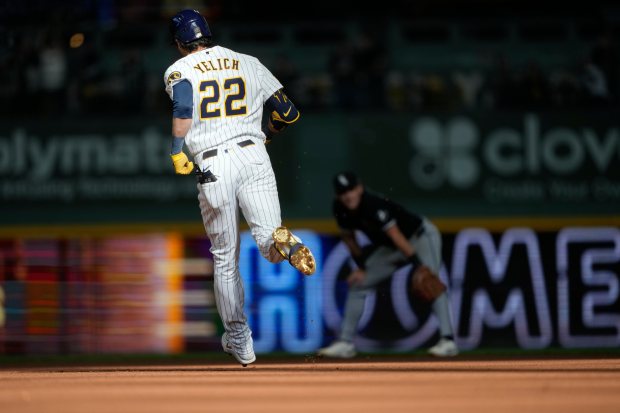 Milwaukee Brewers' Christian Yelich runs the bases after hitting a three-run home run during the eighth inning of a baseball game against the Chicago White Sox, Sunday, March 29, 2026, in Milwaukee. (AP Photo/Kayla Wolf)