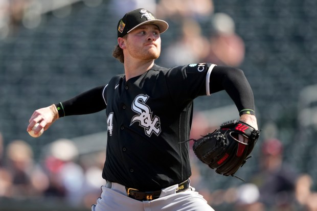 Chicago White Sox pitcher Shane Smith throws during the first inning of a spring training game against the Cleveland Guardians in Goodyear, Ariz., Saturday, Feb. 28, 2026. (AP Photo/Chris Carlson)