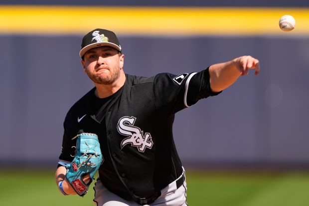 Chicago White Sox starting pitcher Anthony Kay throws during the first inning of a spring training baseball game against the Seattle Mariners, Tuesday, Feb. 24, 2026, in Peoria, Ariz. (AP Photo/Charlie Riedel)