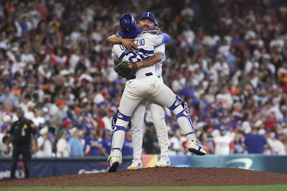 Mar 14, 2026; Houston, TX, United States; Italy catcher JJ D'Orazio (28) and pitcher Greg Weissert (57) celebrate on the mound after the game against Puerto Rico during a quarterfinal game of the 2026 World Baseball Classic at Daikin Park. (Troy Taormina/Imagn Images)